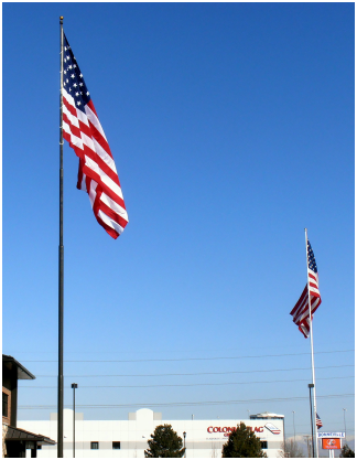Twin tall flagpoles and huge flags