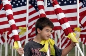 Boy holding flags Murrieta